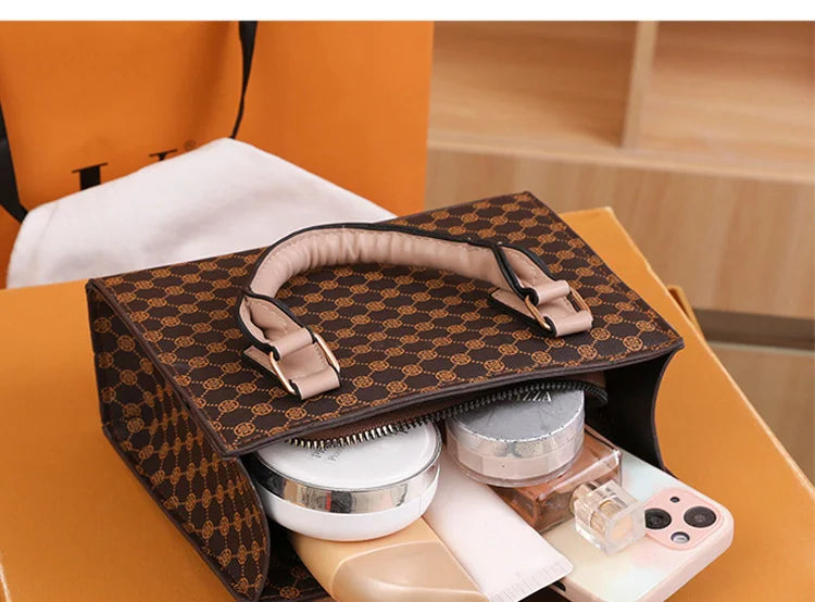 Top-handle bag by Simples Market, brown plaid PU leather with beige handles.