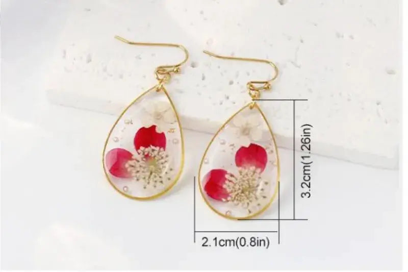 Unique Design Pressed Flower Earring pair in teardrop epoxy resin with red petals and gold-tone frame