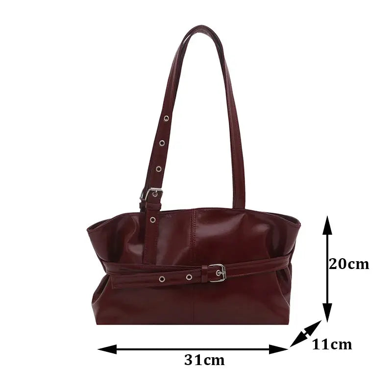 Handbag in burgundy soft leather with belt-buckle waist strap and adjustable shoulder strap, women's casual bag.