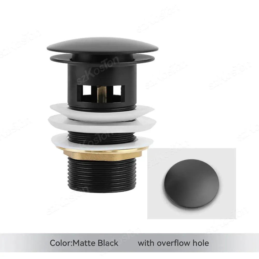 Matte black pop-up bathroom sink drain plug with brass ring and white washers, overflow hole
