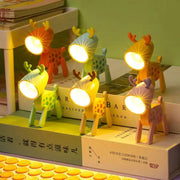 Mini LED night lights; folding desk lamps in deer-shaped cartoon animals, pastel colors, set of 8 on books.