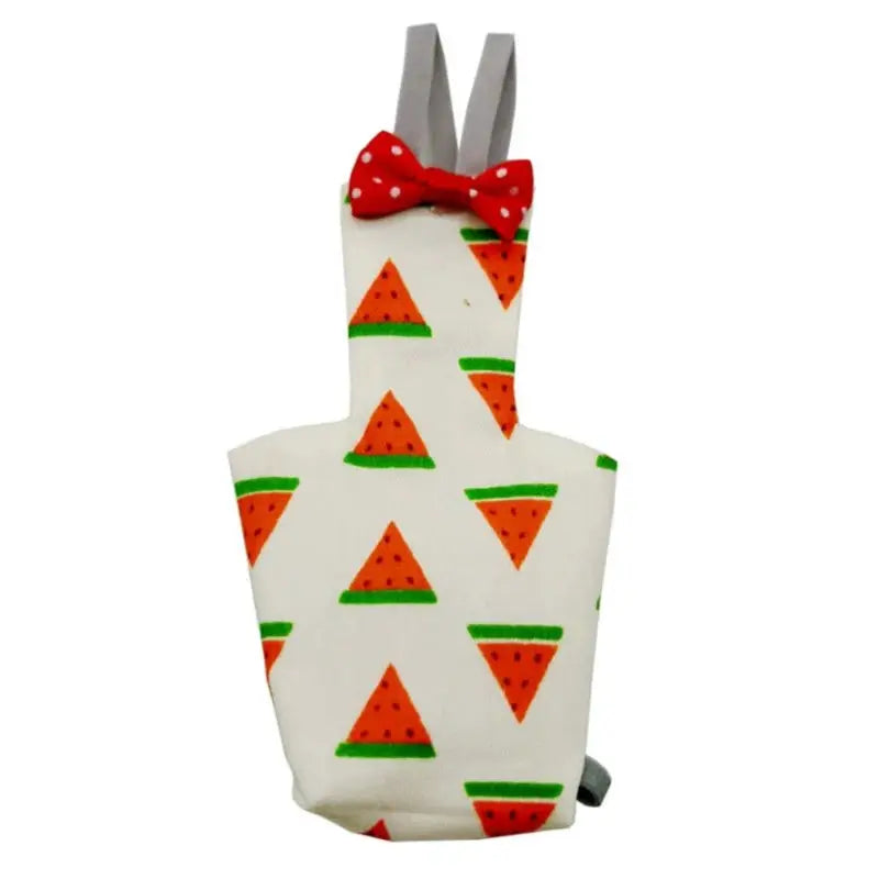 Parrot diaper with bowtie; white fabric featuring orange triangle prints with green accents and grey straps by Simples Market