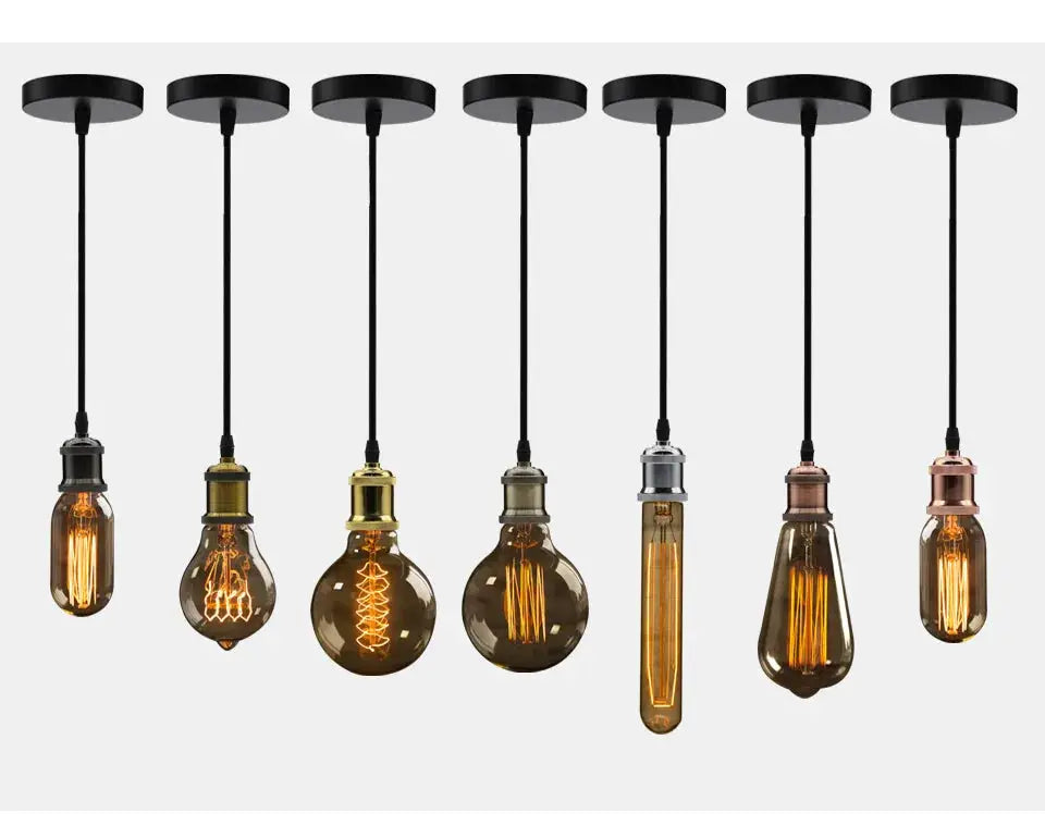 Eight aluminum pendant lights with vintage Edison bulbs in bronze, brass and copper finishes hanging from black cords
