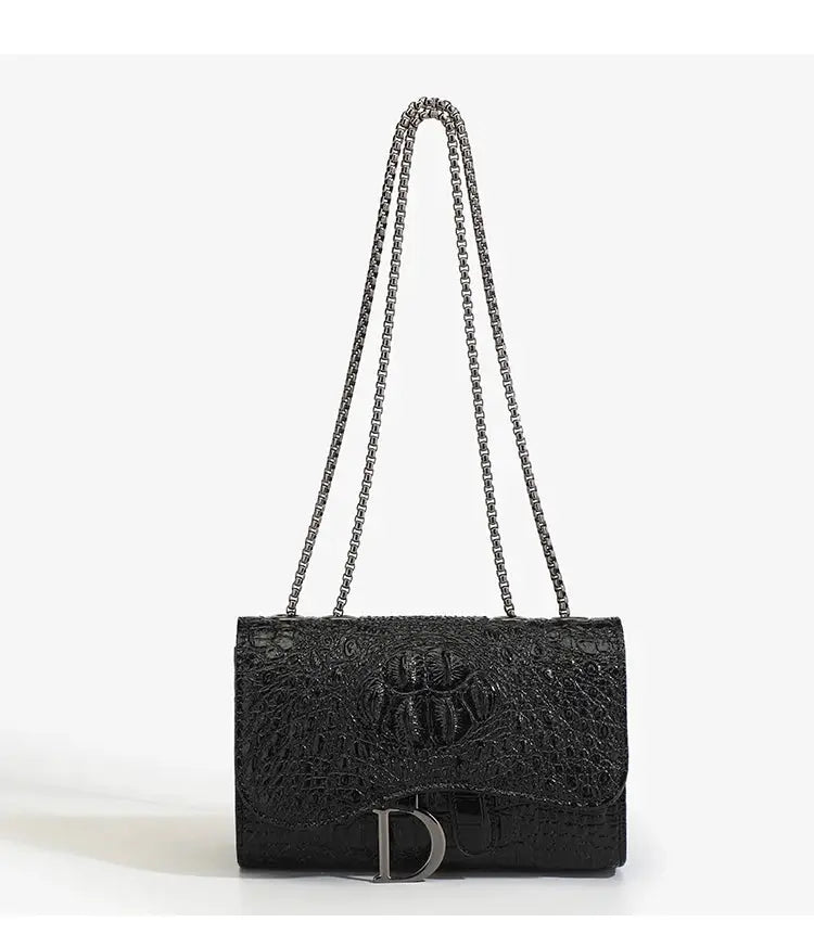 Women's crossbody handbag by Simples Market, black croc-embossed leather with silver chain strap and front D-logo clasp