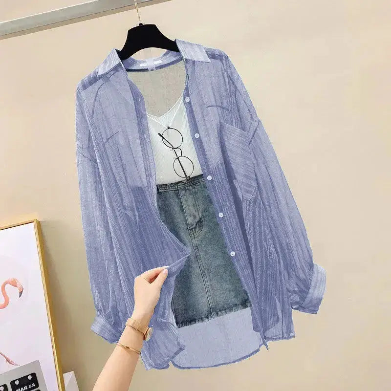Blue striped sheer chiffon blouse, loose-fit see-through top layered over white top with denim skirt