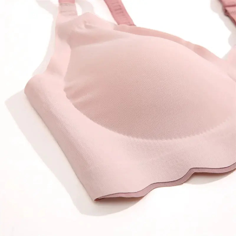 Pink seamless wireless push-up bra with soft fabric and scalloped hem