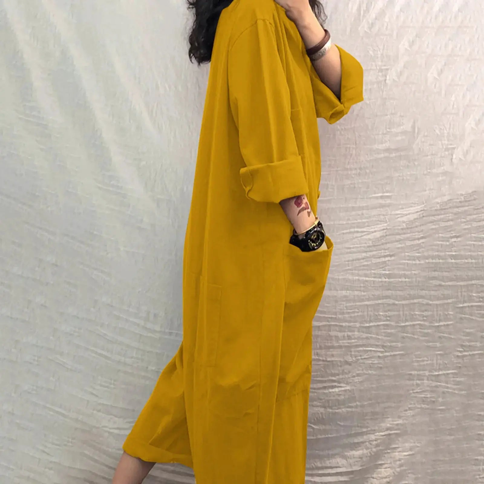 Pocket jumpsuit for women in mustard yellow, loose fit with long sleeves and rolled cuffs - Simples Market