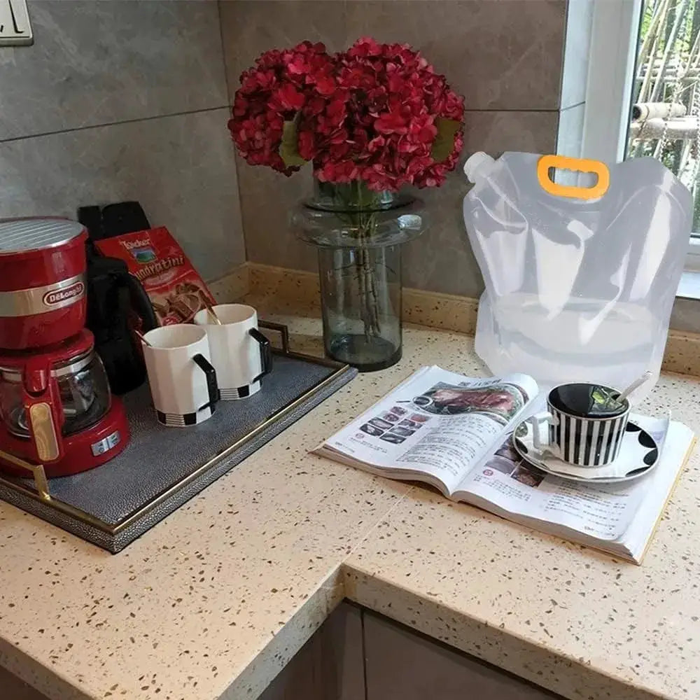 5L folding water bag with orange handle on kitchen counter