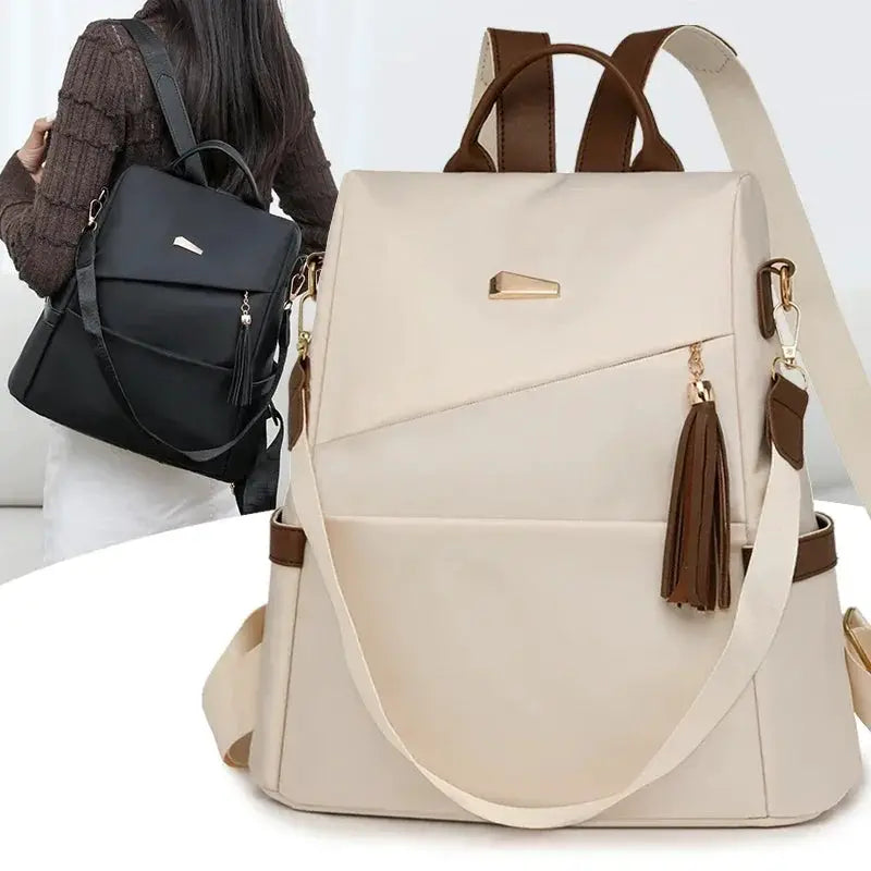 Two Simples Market nylon anti-theft backpacks, beige with tassel accents and brown trim; black version worn by a model.