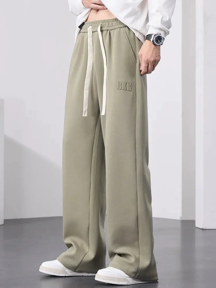 Men's wide-leg cotton track pants by Simples Market in olive with drawstring waist, size 8XL