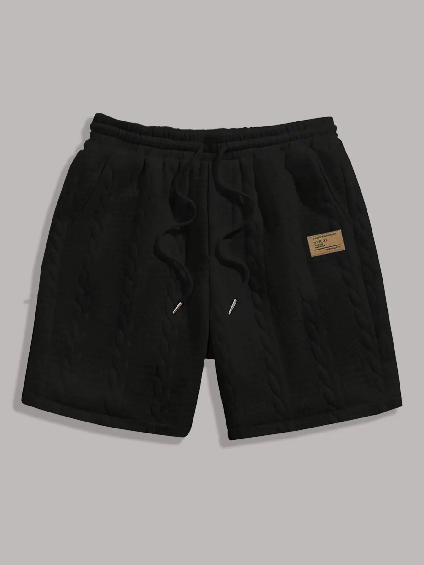 Men's black quilted drawstring shorts with front pockets and patch tag