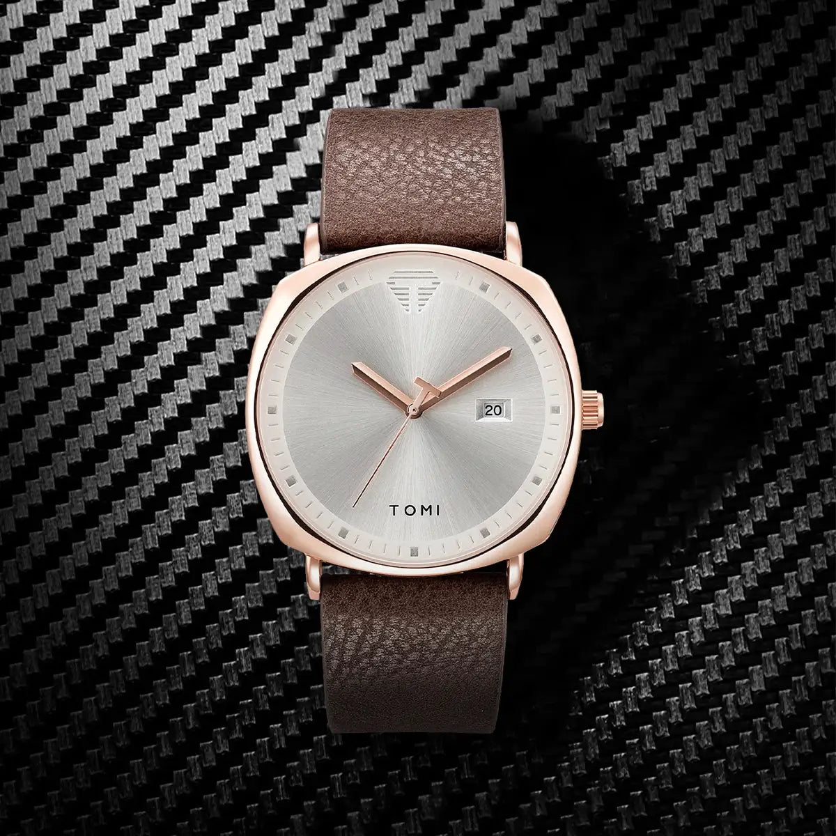 TOMI men's watch with rose gold case, brown leather strap, silver minimalist dial and date window.