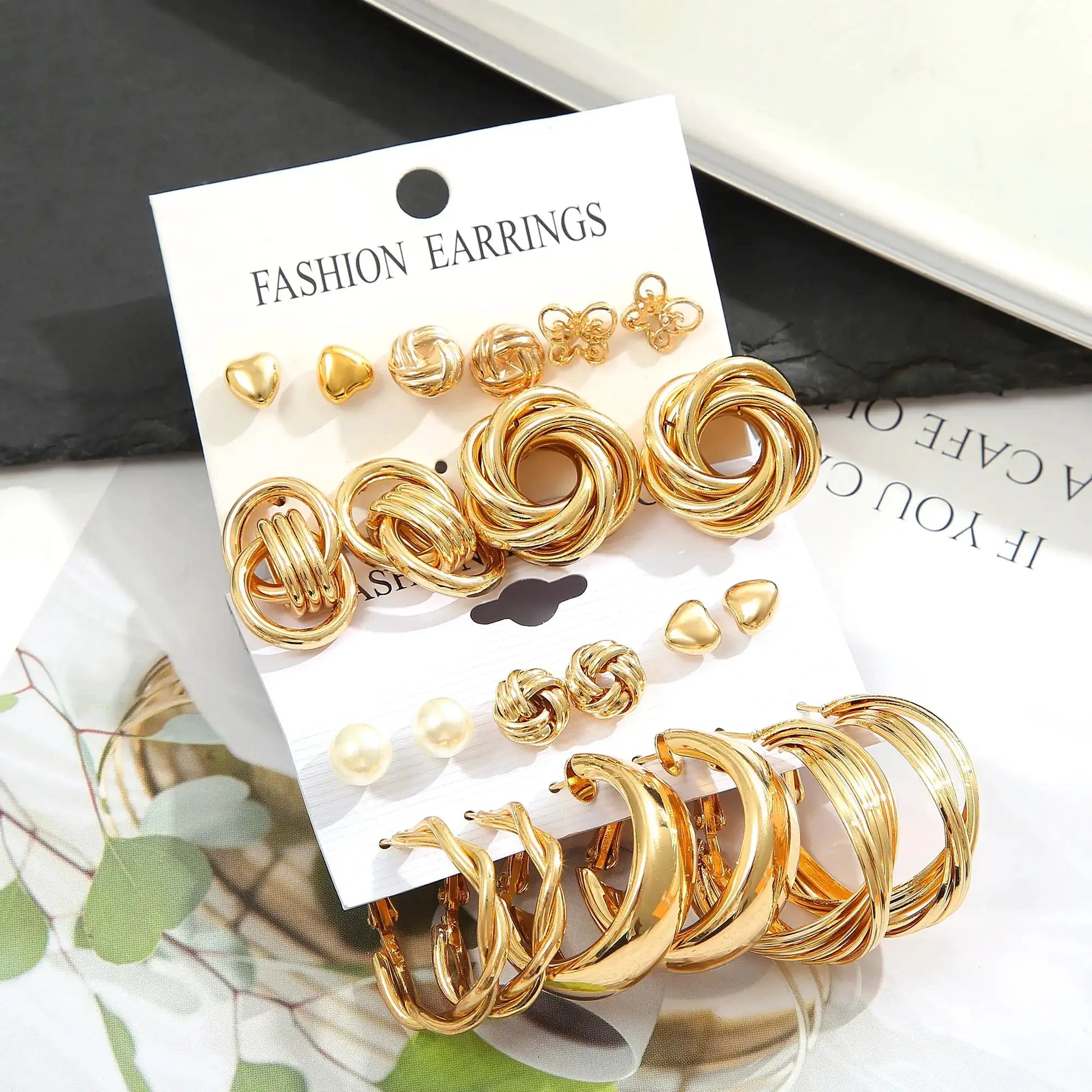 Fashion earrings set with 11 gold-tone zinc alloy pieces featuring faux pearls and geometric hoops