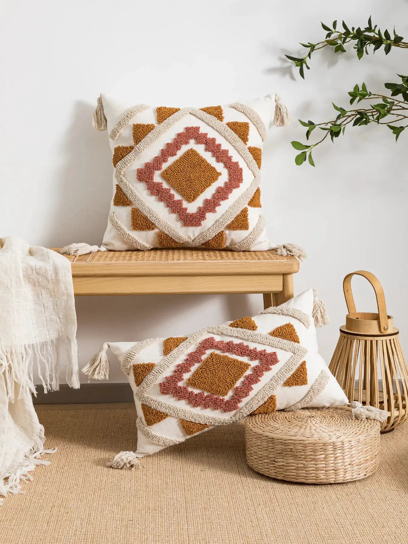 Pillow cover with bohemian geometric loop-velvet texture in cream, rust orange, and pink accents