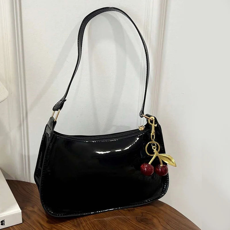 Women's PU leather handbag in black with cherry pendant charm; Simples Market shoulder bag