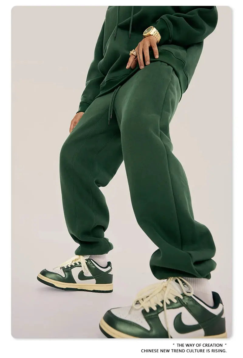 ZODF Trendy fleece sweatpants, unisex green joggers with drawstring waist; pair of Nike sneakers visible