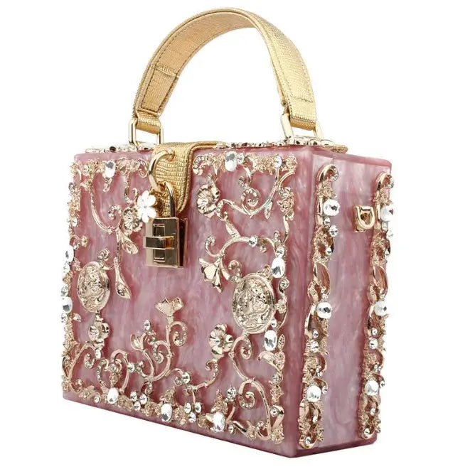 Crystal evening bag by Simples Market, pink hollow-out metal floral design with crystal embellishments, box style.