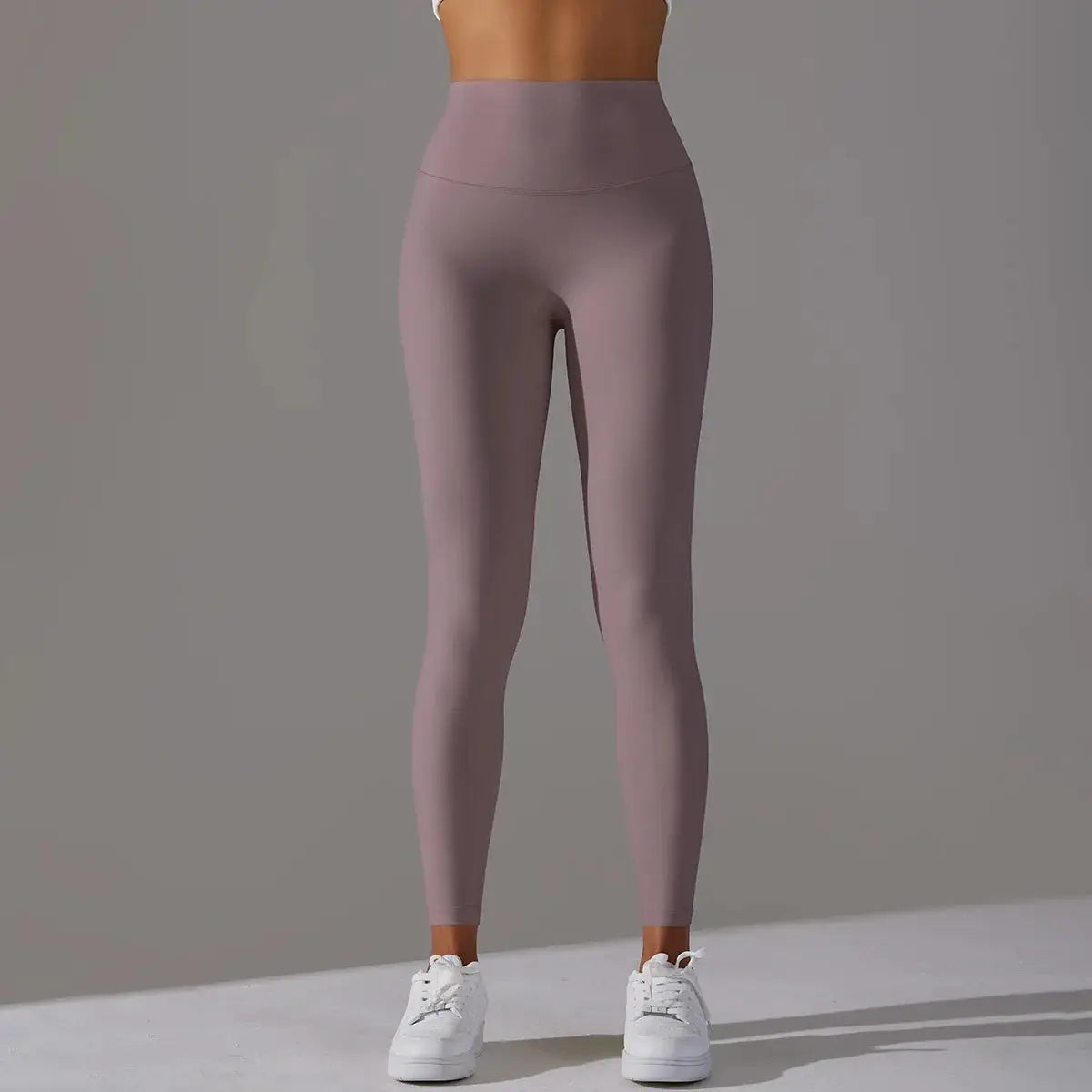 High-waist mauve leggings for women; gym and yoga tight-fit, ankle-length.