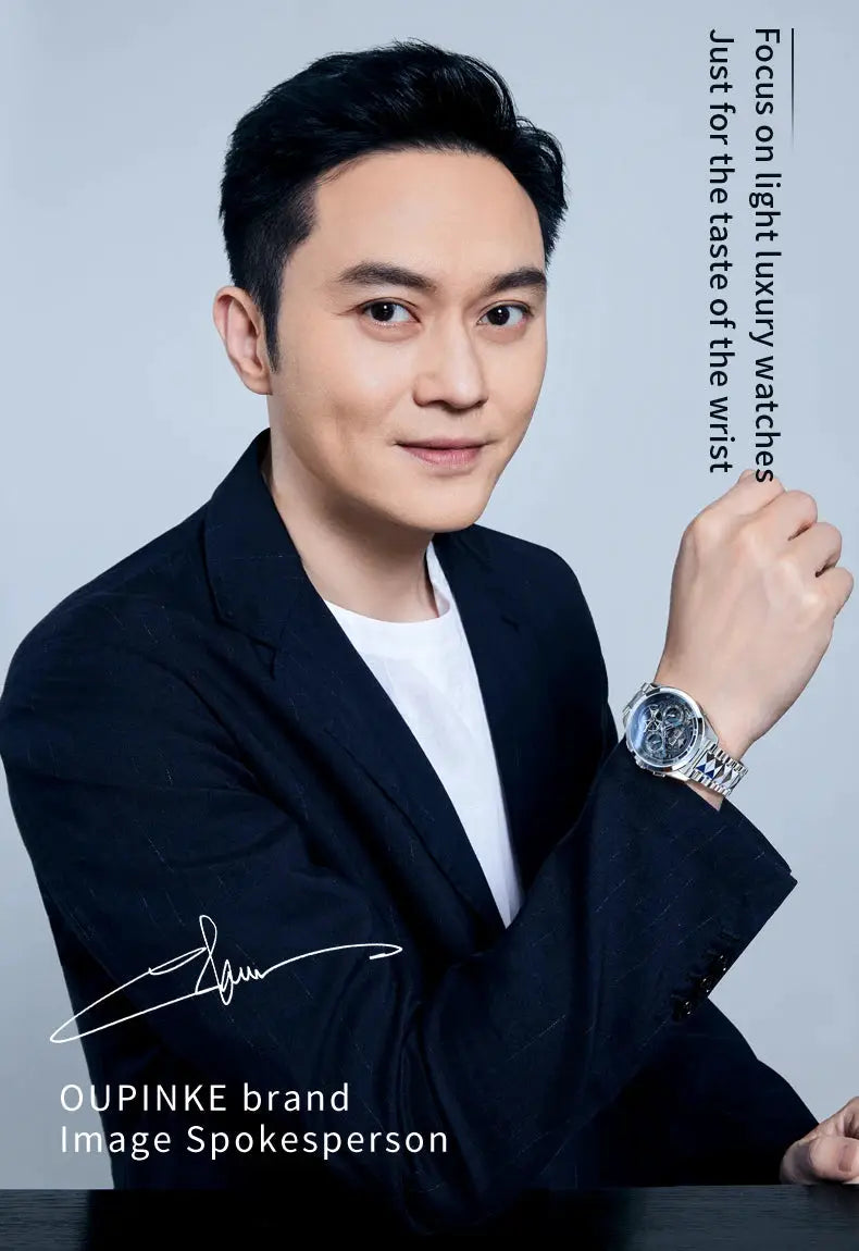 OUPINKE men's skeleton automatic watch on a model's wrist with a silver stainless steel bracelet.