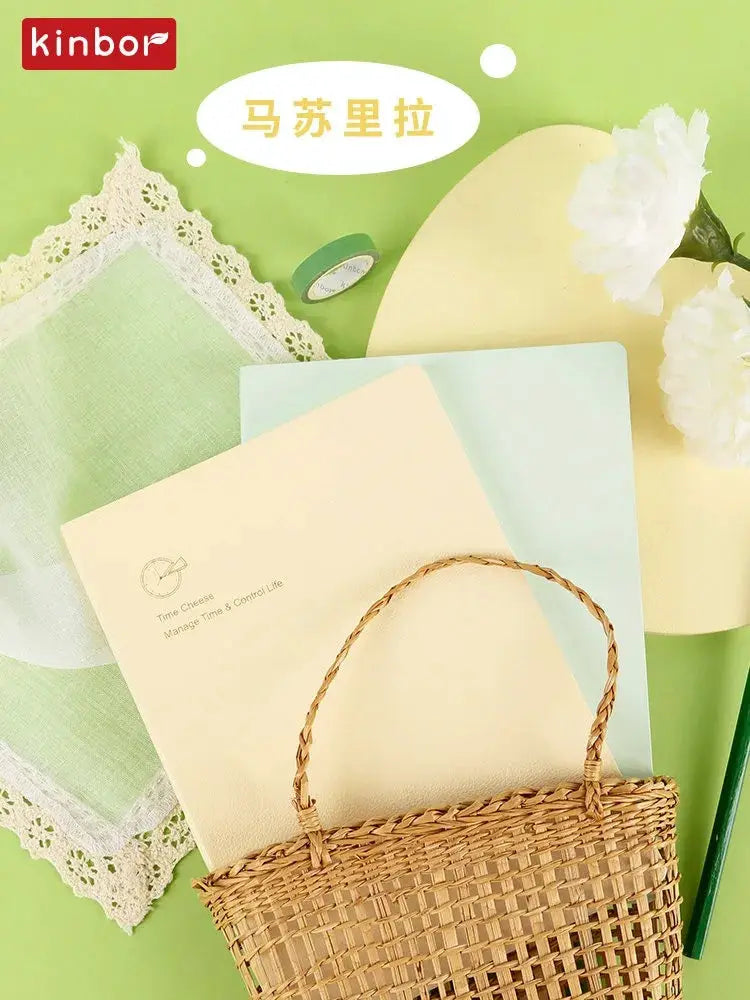 Kinbor weekly planner notebook undated agenda with pastel cream and light blue pages, woven basket accessory