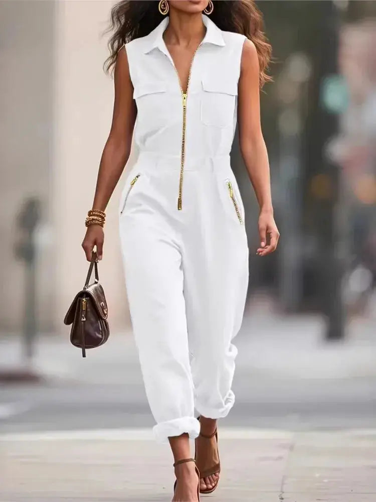 White sleeveless jumpsuit by Simples Market with zip front, turn-down collar, cargo pockets, and cuffed ankles