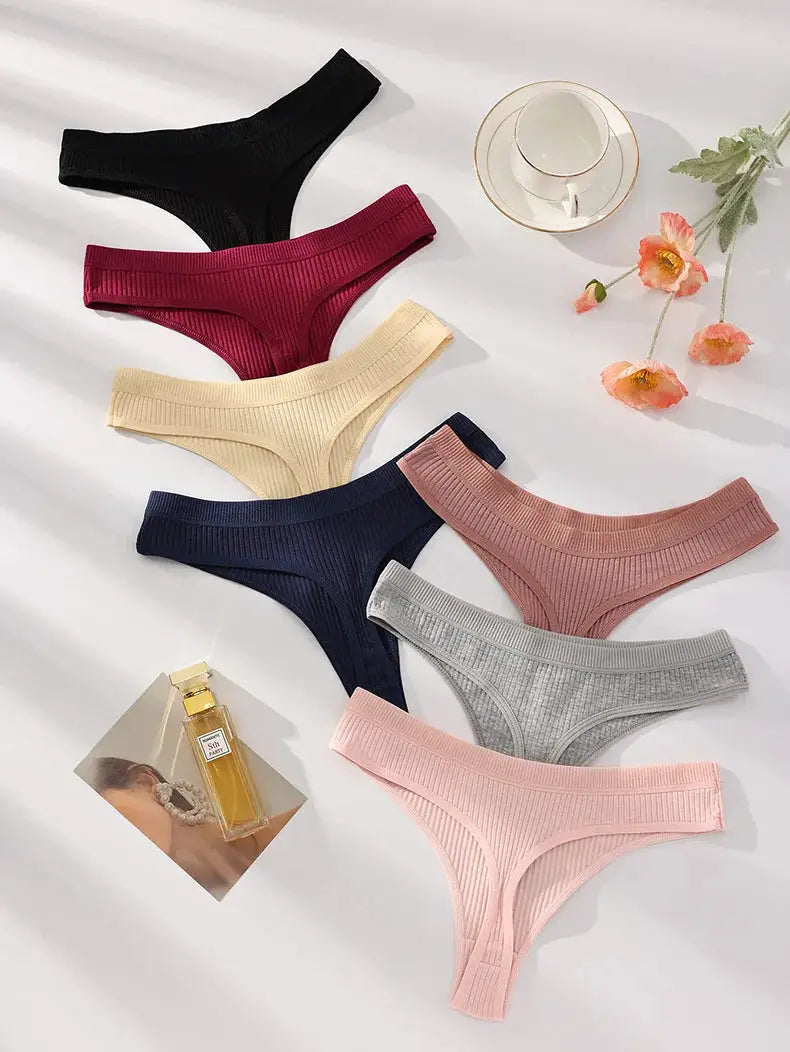 Seven-piece women's cotton thong panty set in assorted colors with ribbed knit