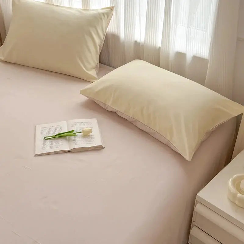2-side solid color brush fabric bed set, 4-piece with cream duvet cover and pillowcases on a pale bed