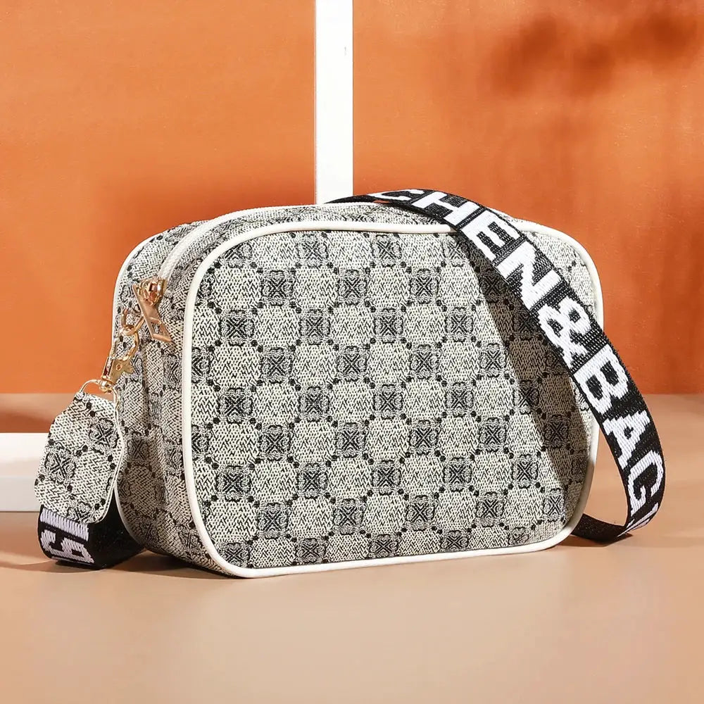 Crossbody bag with matching mini pouch, geometric gray pattern, white trim, adjustable strap, Simples Market.