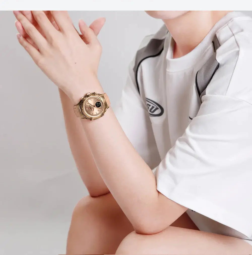 Women's NAVIFORCE sport wristwatch with gold-tone metal band, waterproof construction, dual-time display.