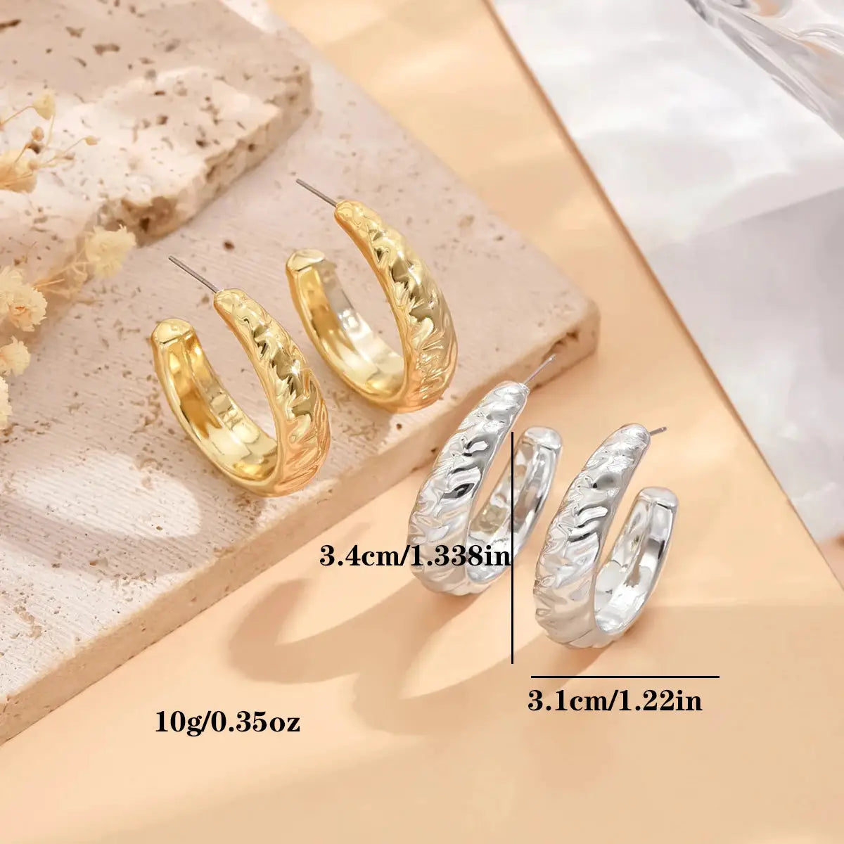 Hoop earrings for women in gold- and silver-tone metal with a textured geometric pattern; sizes 3.4 cm and 3.1 cm