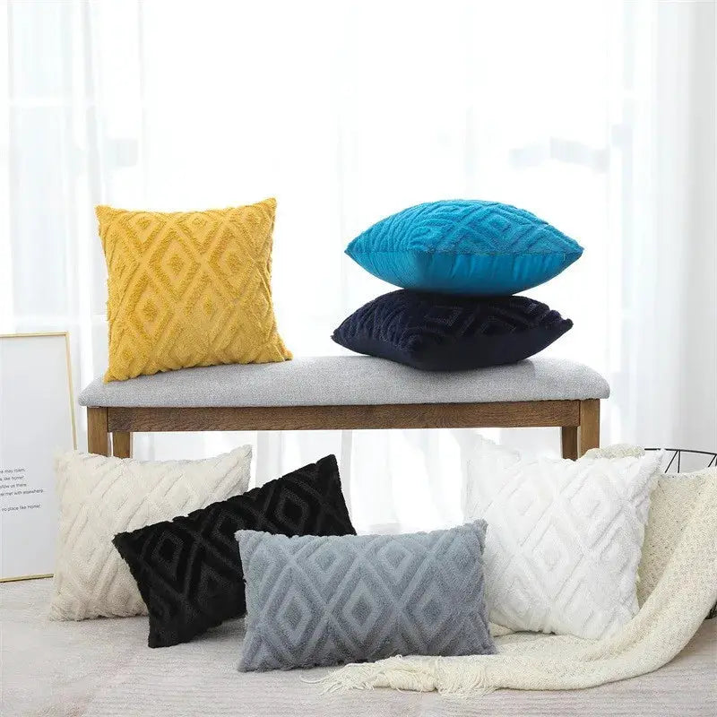 Throw pillow covers by Simples Market in rhombus jacquard plush, assorted colors on bench and floor