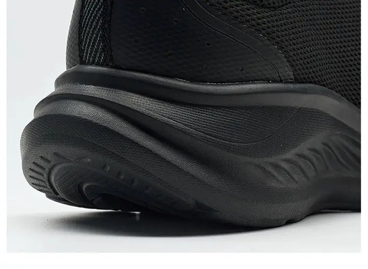 Xtep men's running shoes in black with a thick, shock-absorbing sole