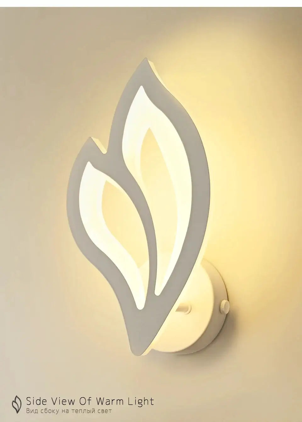 Simples Market leaf-shaped LED wall lamp in white with a warm white glow for living room decor