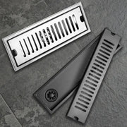 Long stainless steel bathroom floor drain set; rectangular 2-piece with grate and body.