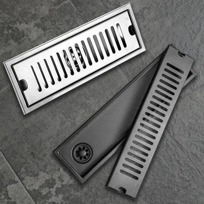 Long stainless steel bathroom floor drain set; rectangular 2-piece with grate and body.