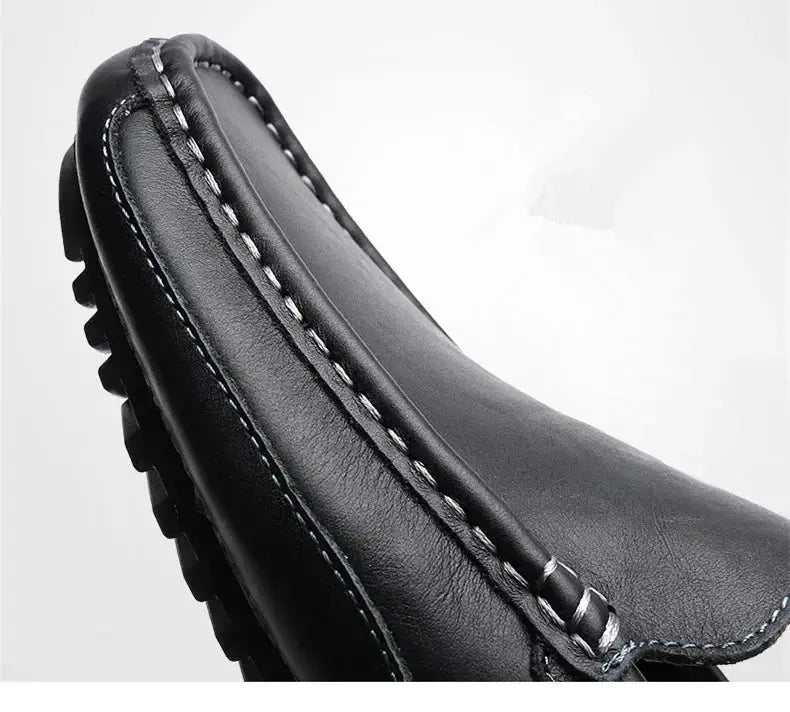 Black genuine leather men's driving moccasins with slip-on design and white stitching