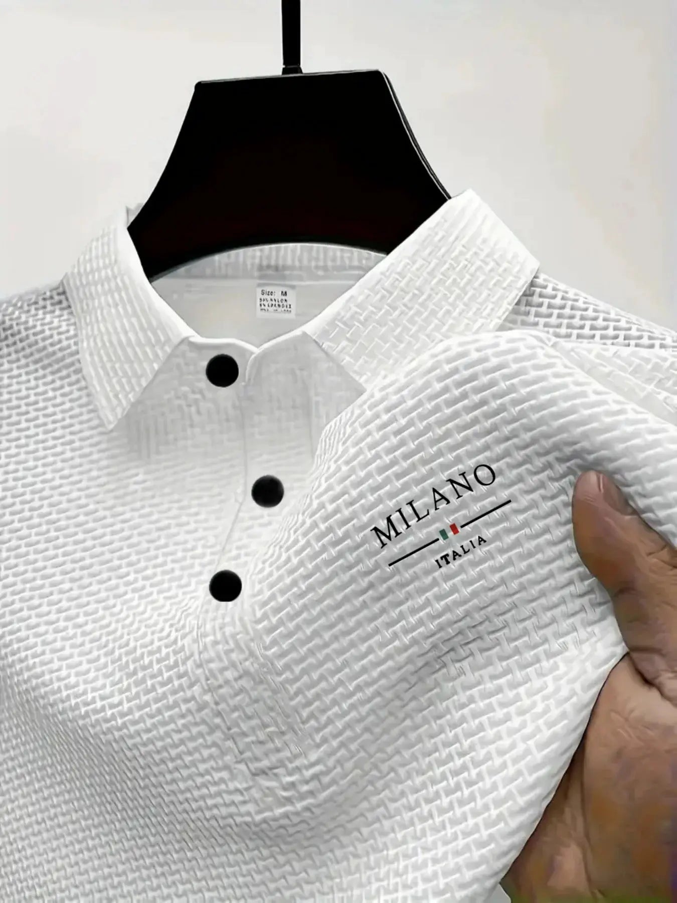 White textured short-sleeve polo shirt for men with black buttons; Milano Italia logo, Simples Market.