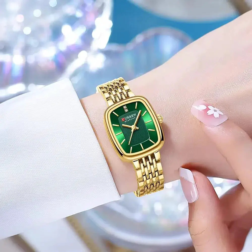 CURRN 9093 women's quartz watch with gold-tone stainless steel band and green dial with diamond accents