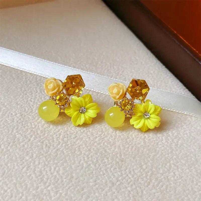 Pair of colorful flower earrings with yellow flower charms, round beads and faceted crystals