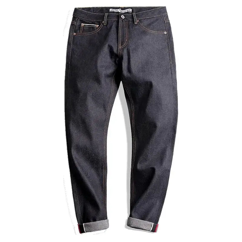 Men's Maden Retro jeans, dark indigo raw denim with orange contrast stitching and rolled cuffs