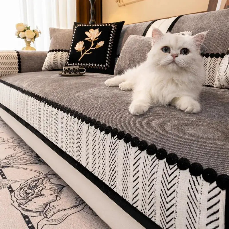 Sofa cover by Simples Market; contrast-hem twill chenille non-slip slipcover with black trim on gray couch