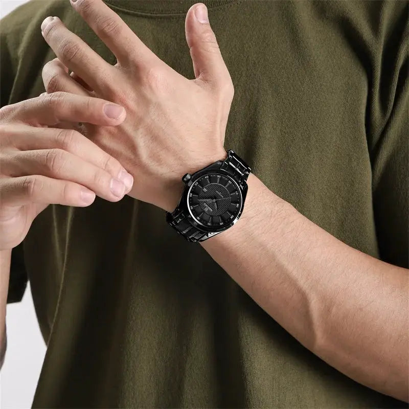 NAVIFORCE men's watch with black stainless steel strap and black dial on wrist