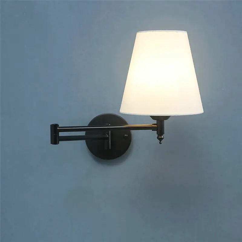 Nordic adjustable folding wall lamp by Simples Market with black metal arm and white LED lampshade