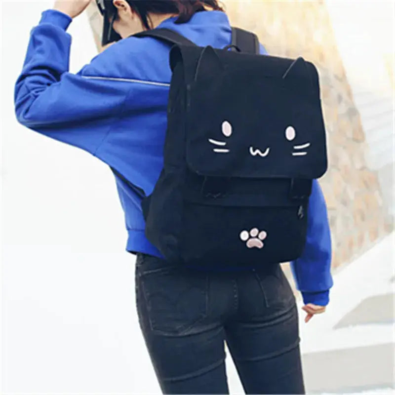 3D Cat backpack from Simples Market, black canvas with cute cat face and paw print on front pocket