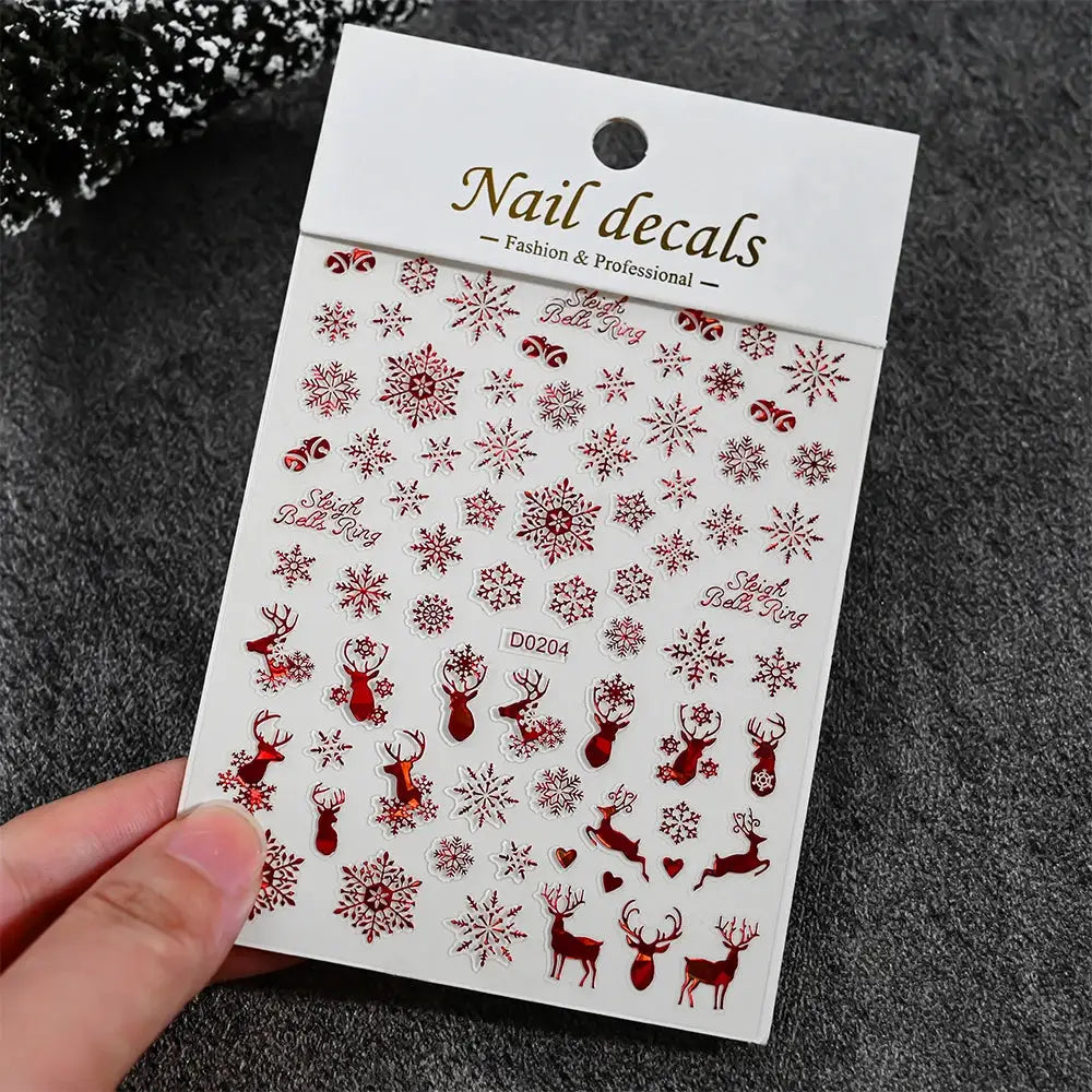 Nail decals sheet by Simples Market featuring red snowflakes and reindeer, self-adhesive winter nail art stickers