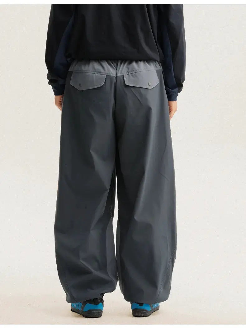 Wide-leg grey cargo pants with back flap pockets, outdoor techwear look