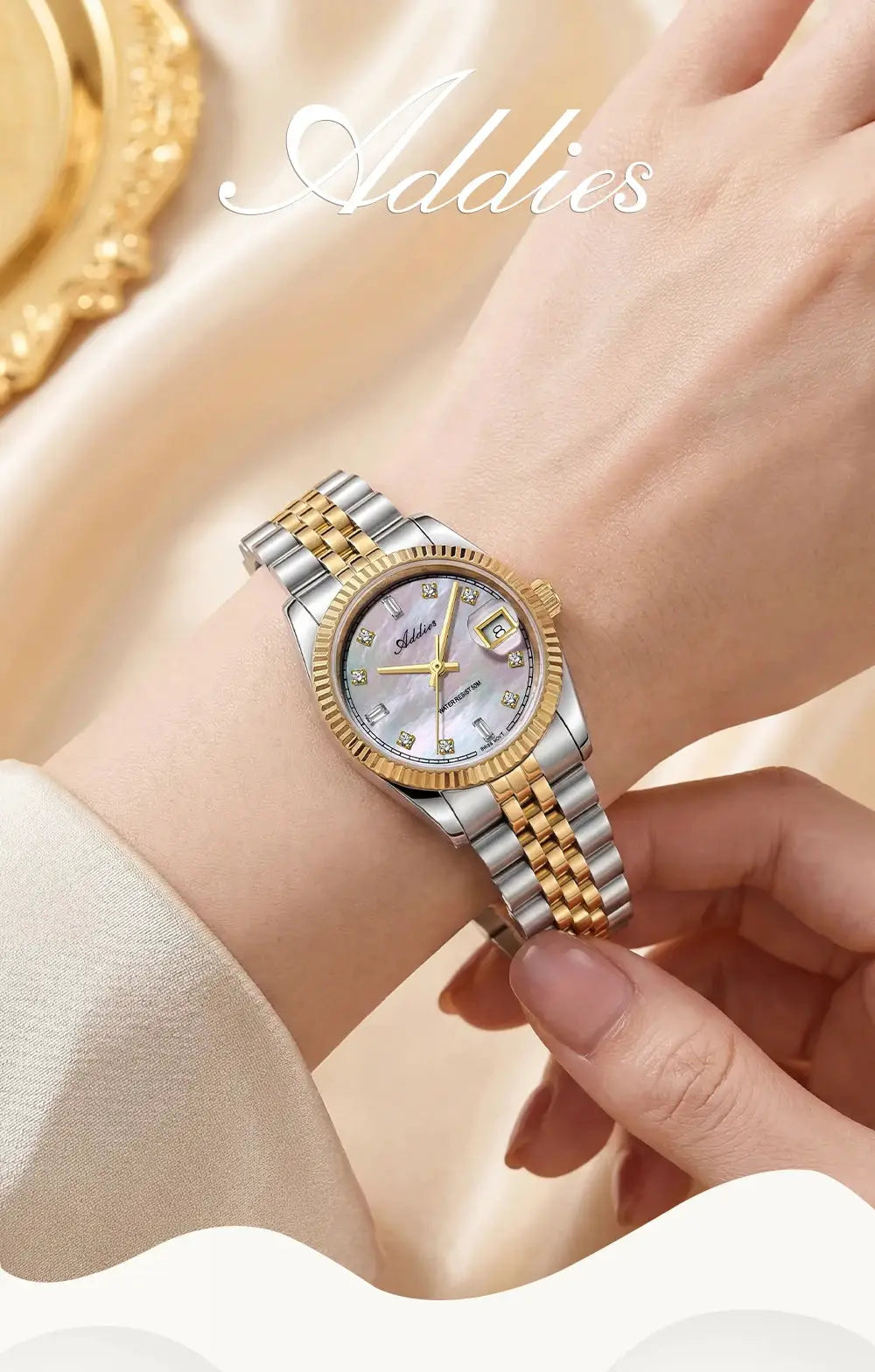 Adddies two-tone stainless steel women's watch with gold bezel; mother-of-pearl dial and diamond markers