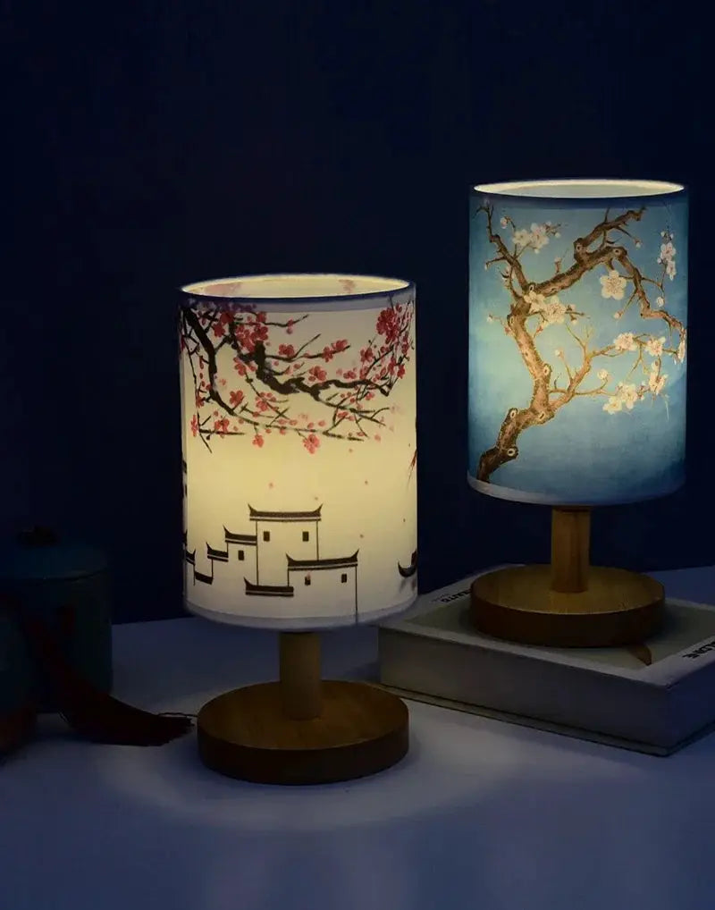 Two LED table lamps with fabric plum-blossom shades on wooden bases
