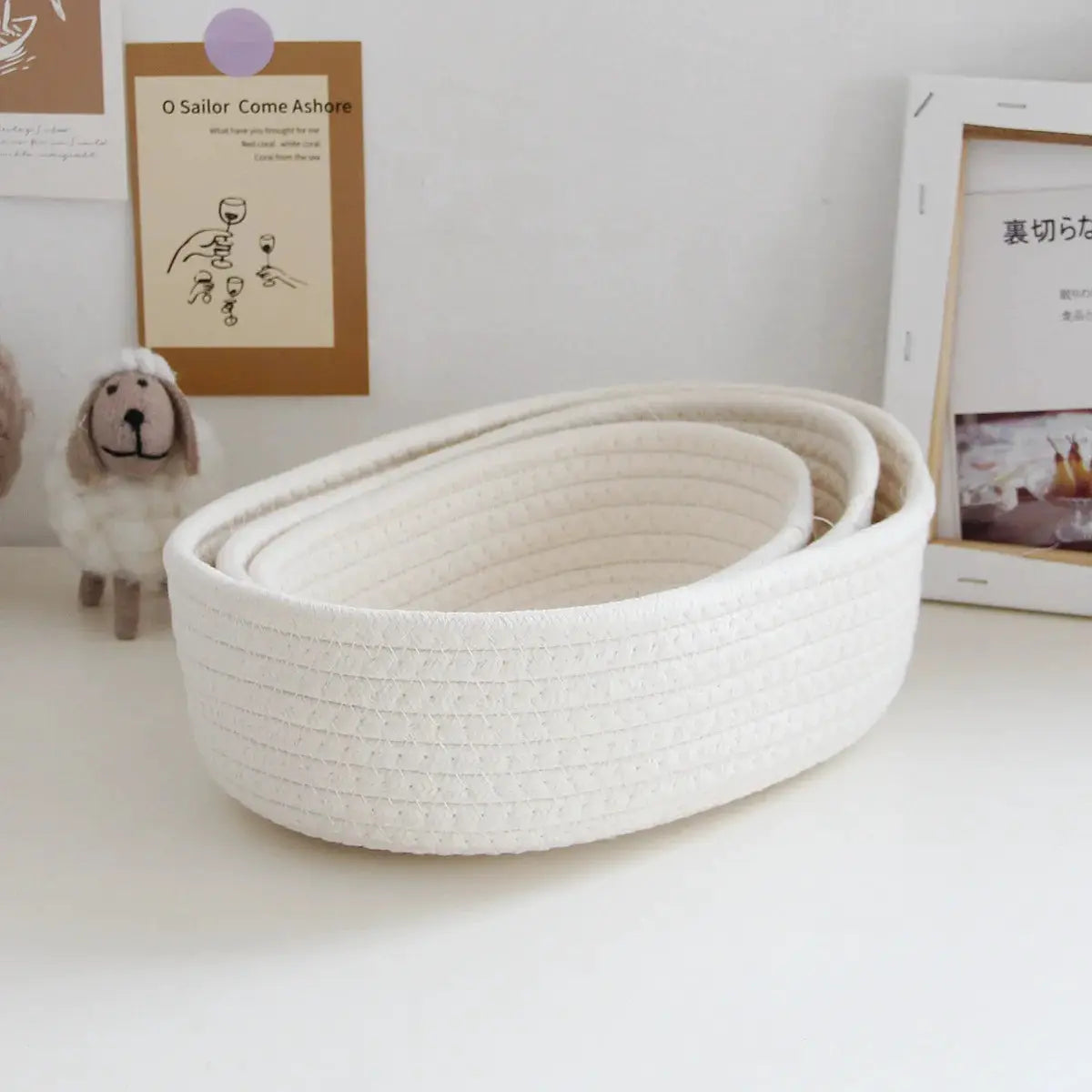 White woven storage basket set for desktop organization; oval, space-saving, suitable for cosmetics and stationery.