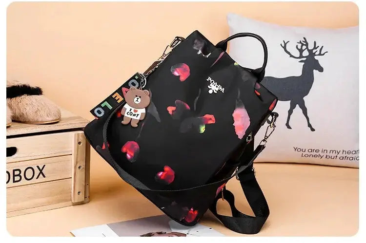 Women’s black Oxford cloth backpack with a colorful print, large-capacity school bag by Simples Market